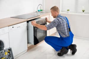 Repairman Repairing Oven